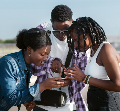 three friends looking at phone